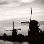 Black and white photograph by Bernard Donjean depicting three windmills in Kinderdijk (thumbnail)