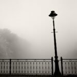 Black and white photograph by Bernard Donjean that shows a street lamp on a bridge (name of the photograph : Street Lamp)