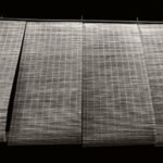 Black and white photograph by Bernard Donjean that shows four lighted japanese blinds (name of the photograph : Unfolded Blinds)