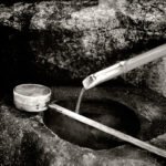 Black and white photograph by Bernard Donjean that shows a japanese purification fountain (name of the photograph : Purification Fountain)