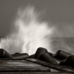 Black and white photograph by Bernard Donjean that shows a wave broken by a wave breaker (name of the photograph : Broken Wave, #2)