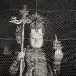 Black and white photograph by Bernard Donjean that shows a Bishamonten statue located inside of the central gate of Todai-ji temple in Nara (name of the photograph : Bishamonten Statue)