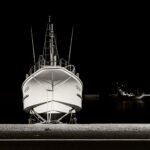 Black and white photograph by Bernard Donjean that shows resting fishing boats (name of the photograph : Resting Boats)