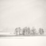 Black and white photograph by Bernard Donjean that shows a snow shower over Akimoto Lake (name of the photograph : Snow Shower over Akimoto Lake)