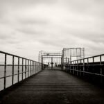 Black and white photograph by Bernard Donjean that shows the closed gate of an harbour (name of the photograph : Harbour gate)