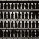 Black and white photograph by Bernard Donjean that shows eighty-eight Sho-Kannon statues in a frame (name of the photograph : Eighty-Eight Sho-Kannon Statues)