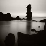 Black and white photograph by Bernard Donjean that shows a rock formation on the sea shore (name of the photograph : Kaketo Matsushima Rock)