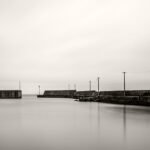 Black and white photograph by Bernard Donjean that shows an empty and calm japanese harbour (name of the photograph : Quiet Port)