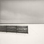 Black and white photograph by Bernard Donjean that shows a snow fence in winter (name of the photograph : Snow Fence, study 2)