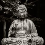 Black and white photograph by Bernard Donjean that shows the statue of a meditating Buddha (name of the photograph : Meditation)