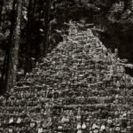 Black and white photograph by Bernard Donjean that shows a pyramid composed by hundreds of small gravestone in the Okuno-In cemetery (name of the photograph : Gravestones Pyramid)