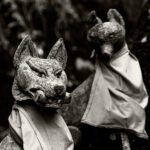 Black and white photograph by Bernard Donjean that shows two statues of sacred guardian fox (name of the photograph : Two Fox Guardians)