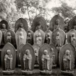 Black and white photograph by Bernard Donjean that shows twenty-three statues of Jizo (name of the photograph : Twenty-Three Jizo Statues)