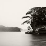 Black and white photograph by Bernard Donjean that shows the shore of an island in the Matsushima Bay (name of the photograph : Matsushima Bay, #2)