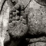 Black and white photograph by Bernard Donjean that shows the palm of an hand of a stone statue, representing the Abhaya Mudra hands position in buddhism (name of the photograph : Abhaya Mudra Hands Gesture)