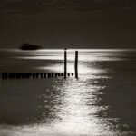 Black and white photograph by Bernard Donjean that a ship arriving at the end of its travel (name of the photograph : Nigh End)