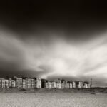 Black and white photograph by Bernard Donjean that shows the buildings of the coastal resort of Knokke-Heist (name of the photograph : Heist Coast)