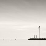 Black and white photograph by Bernard Donjean that shows the entrance of the harbour in Ostende (name of the photograph : Harbour Entrance)