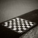 Black and white photograph by Bernard Donjean that shows a street chessboard in Ostende (name of the photograph : Street Chessboard)
