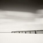 Black and white photograph by Bernard Donjean that shows sand fences on the beach of Knokke (name of the photograph : Sand Fences)