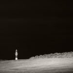 Black and white photograph by Bernard Donjean that shows the Nieuwpoort's lighthouse (name of the photograph : Nieuwpoort's Lighthouse)